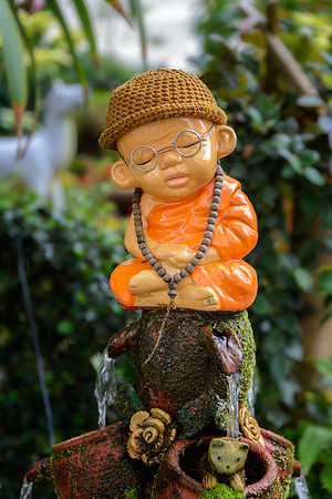 Monk garden statue