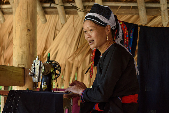 Phan Nhot at her sewing machine