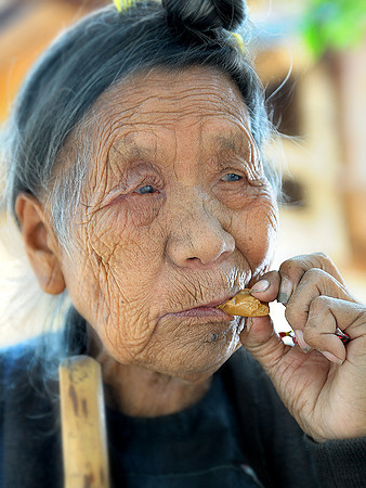 Biasha grandmother eating candies.