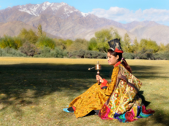 Blue shoes and prayer wheel
