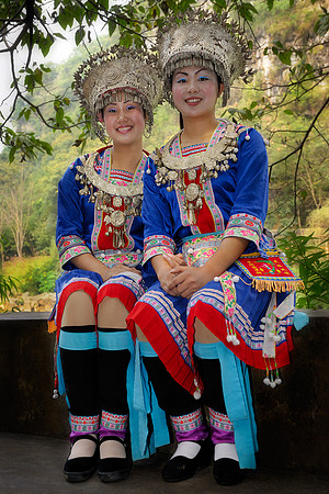 Girls dressed in Miao costumes